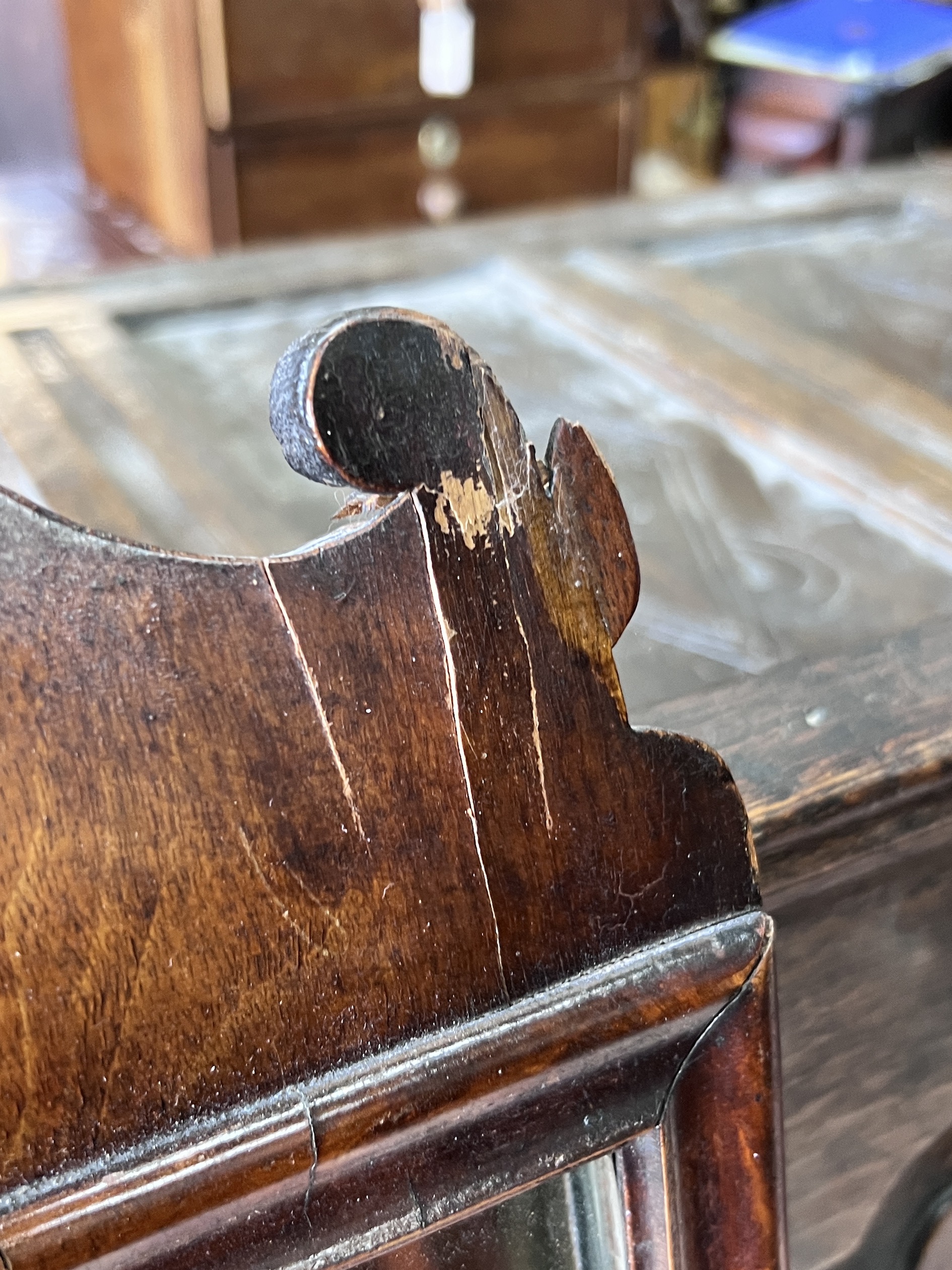 An 18th century walnut fret cut wall mirror, width 36cm, height 68cm